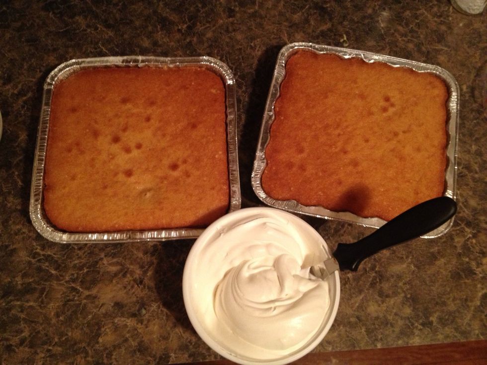 Take your cool whip and spread out over the cake(s).