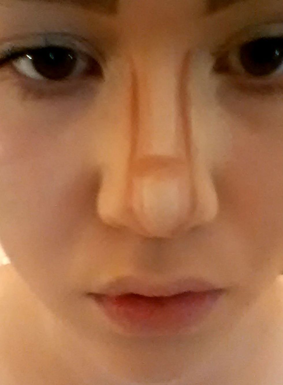 Take your darker colour again and apply a small line across the bridge of your nose. This is to make it appear more turned upwards.