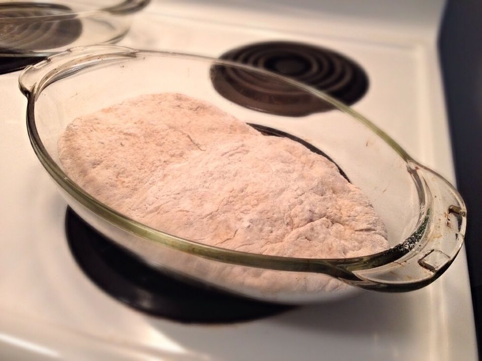 Take your dish carefully out of the oven. Place the dough in the dish (this can be tricky at first). Put the lid back on and place the dish back in the oven.