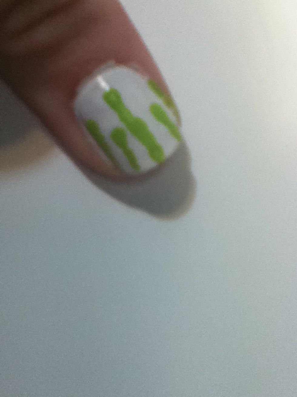 Take your dotter and make streaks going down your nail