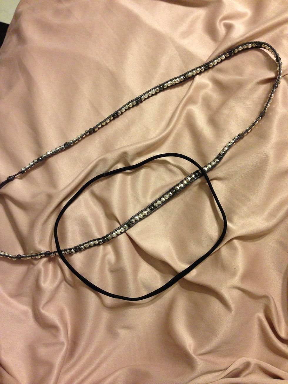 Take your elastic headband and place it over your wrap bracelet.