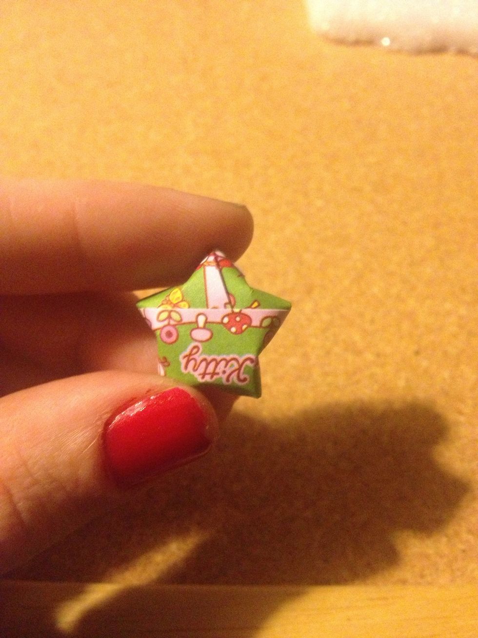 Take your finger and make a small indent on each side. Don't do it too much or it will make the star look funny or not puff out nicely.