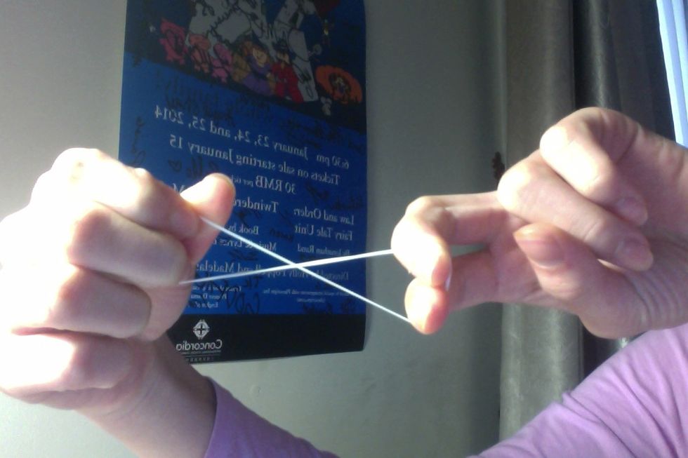 Take your first band, (mine is white), and turn it so it is in the shape of an '8' or a infinity sign.