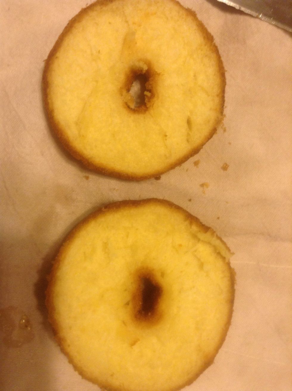 Take your first cronut and cut carefully in half. They are very flaky so be gentle!