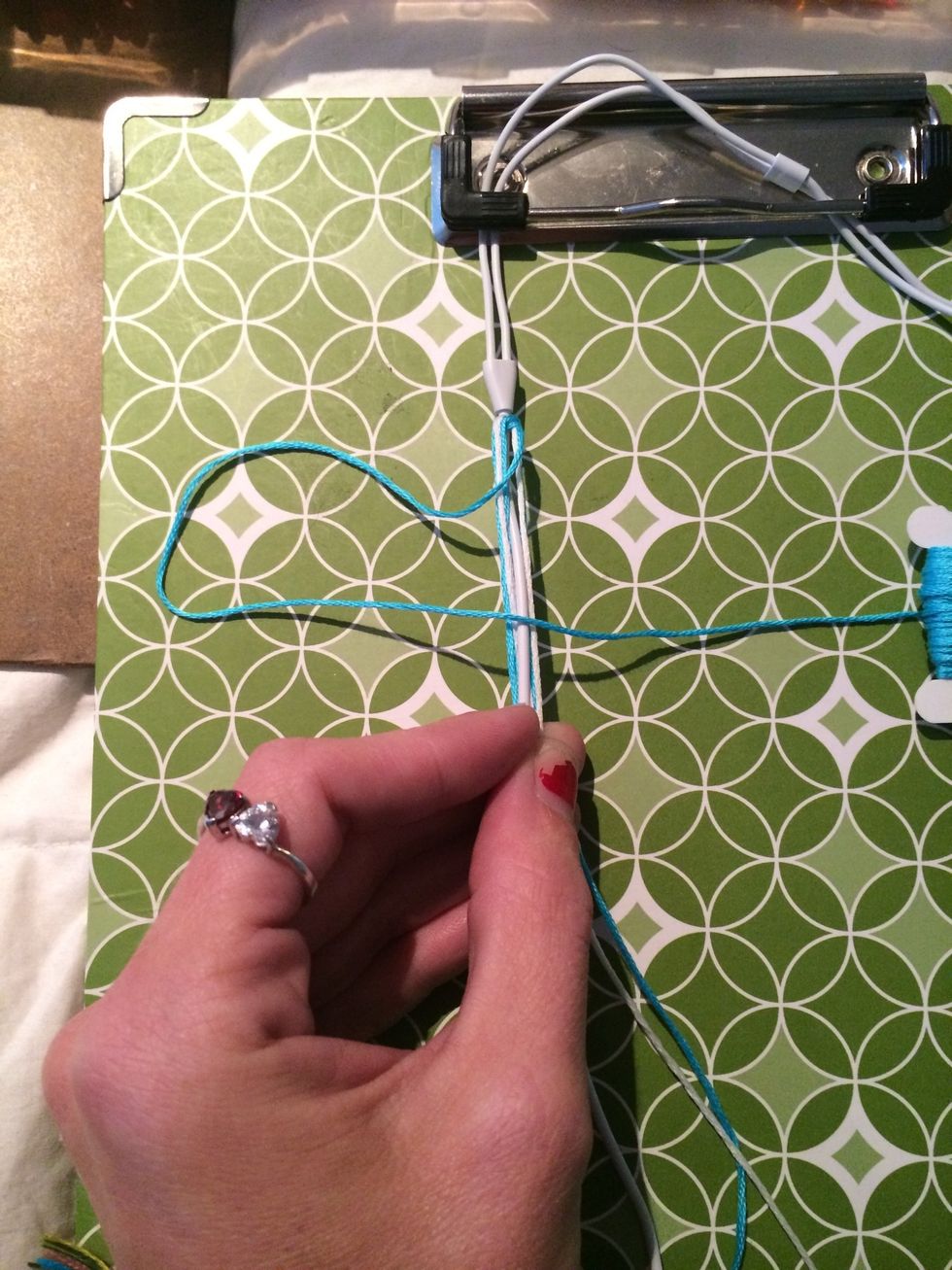 Take your first piece of string and make a 4.