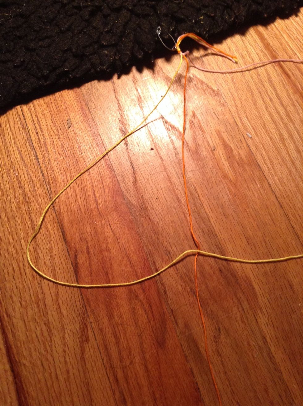 Take your first string and lay it over your second string
