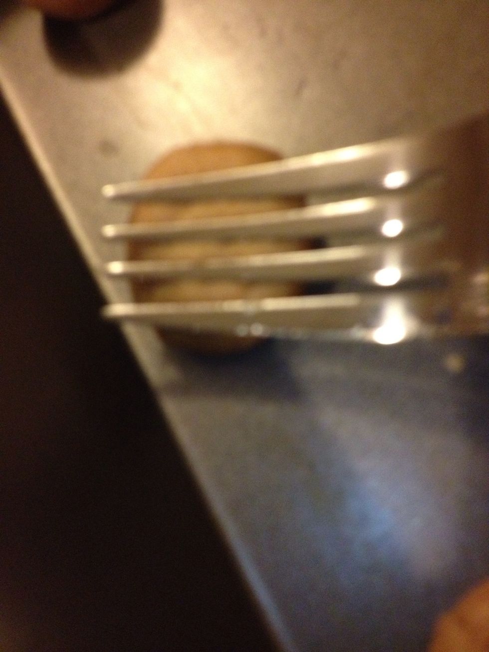 Take your fork side ways and press down about half way.