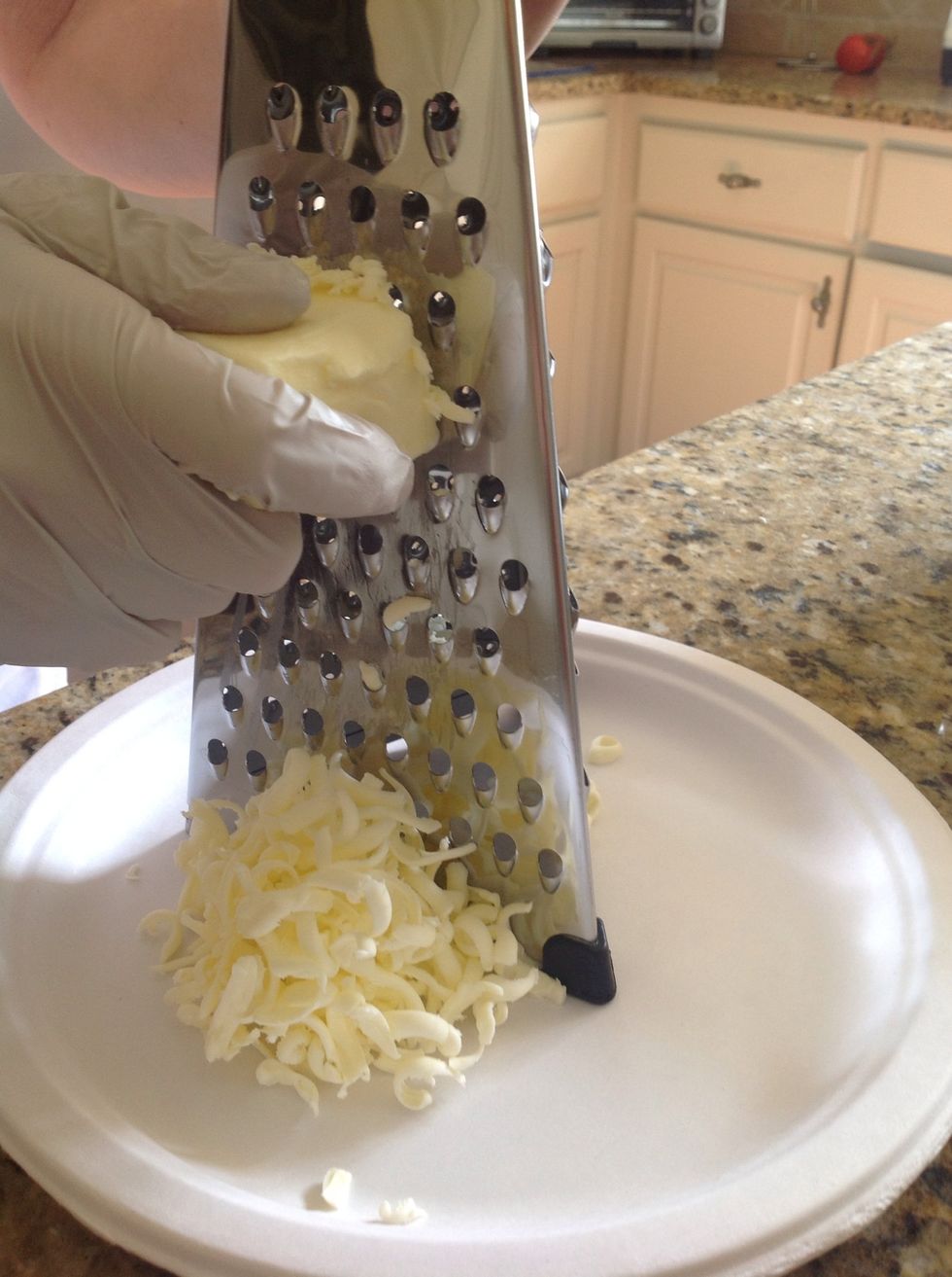 Take your frozen 6 Tablespoons of butter and grate on the medium side of grater. You can also cut into small pieces with a sharp knife if you don't have a grater.
