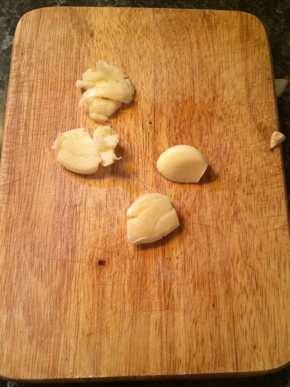 Take your garlic clove and give it a little smash using the back of a knife