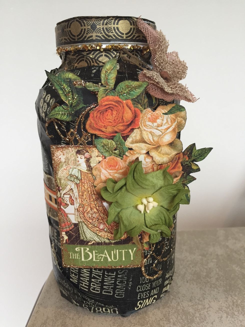 Take your gold Stickles and outline the "Beauty" image. Note how I outlined the gold lines in the flower image, too. You can also add some freehand swirls like I did.