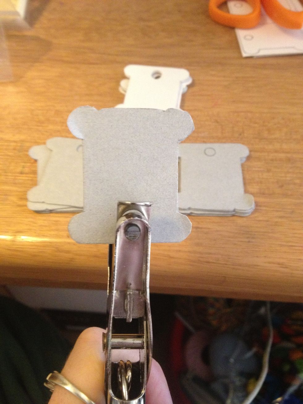 Take your hole punch and make the hole at the top. You don't have to do this if you don't want to.