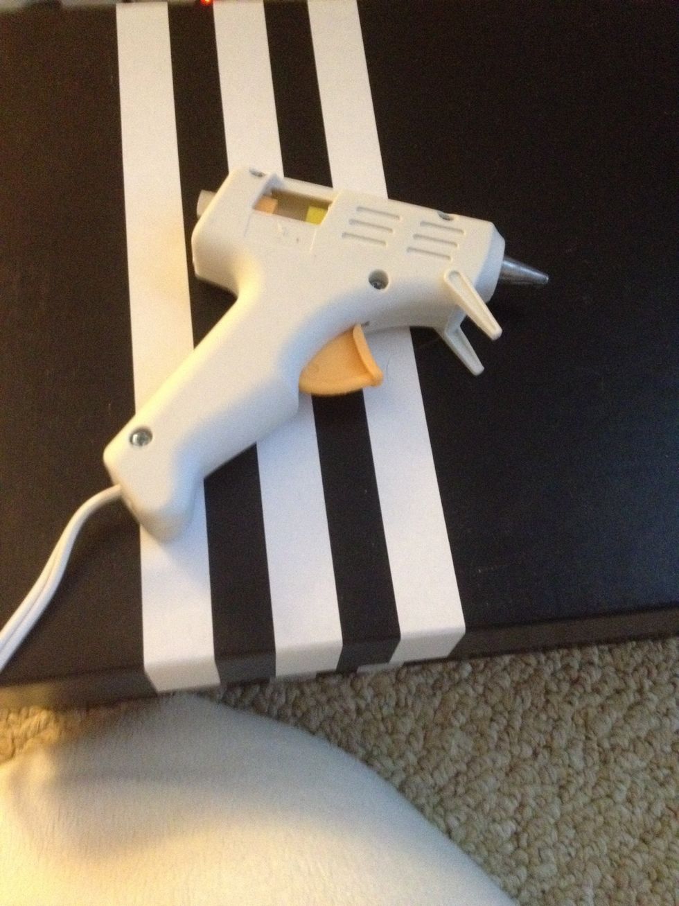 Take your hot glue gun and fill it up with hot glue sticks