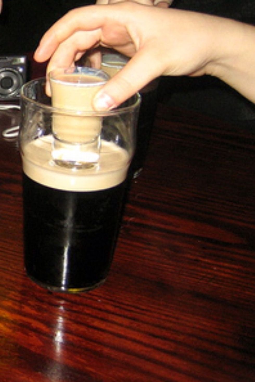 Take your Jameson and Baileys shot glass and drop it into the Guinness!