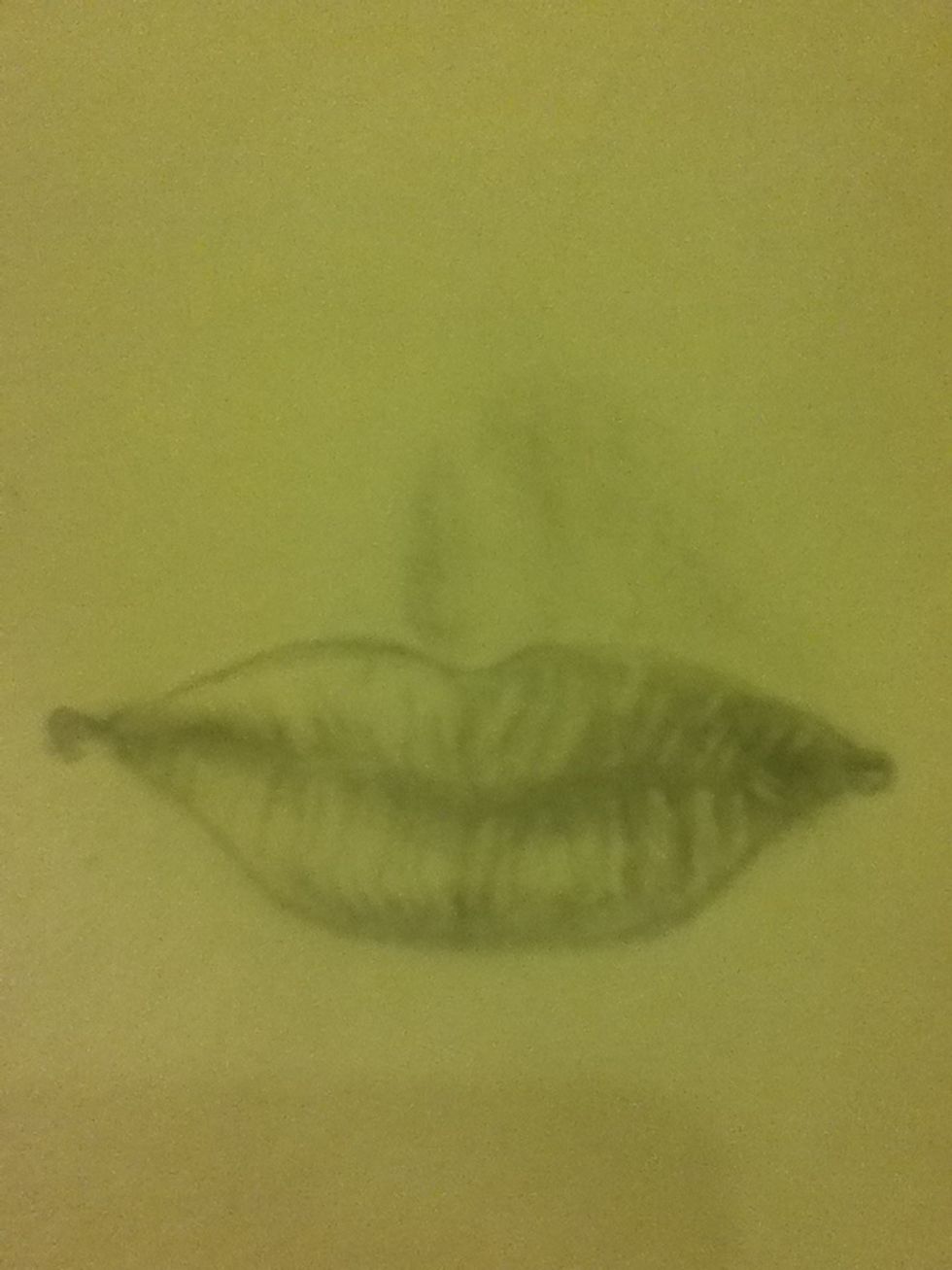 Take your knead eraser and go back and make more highlights in the lips!