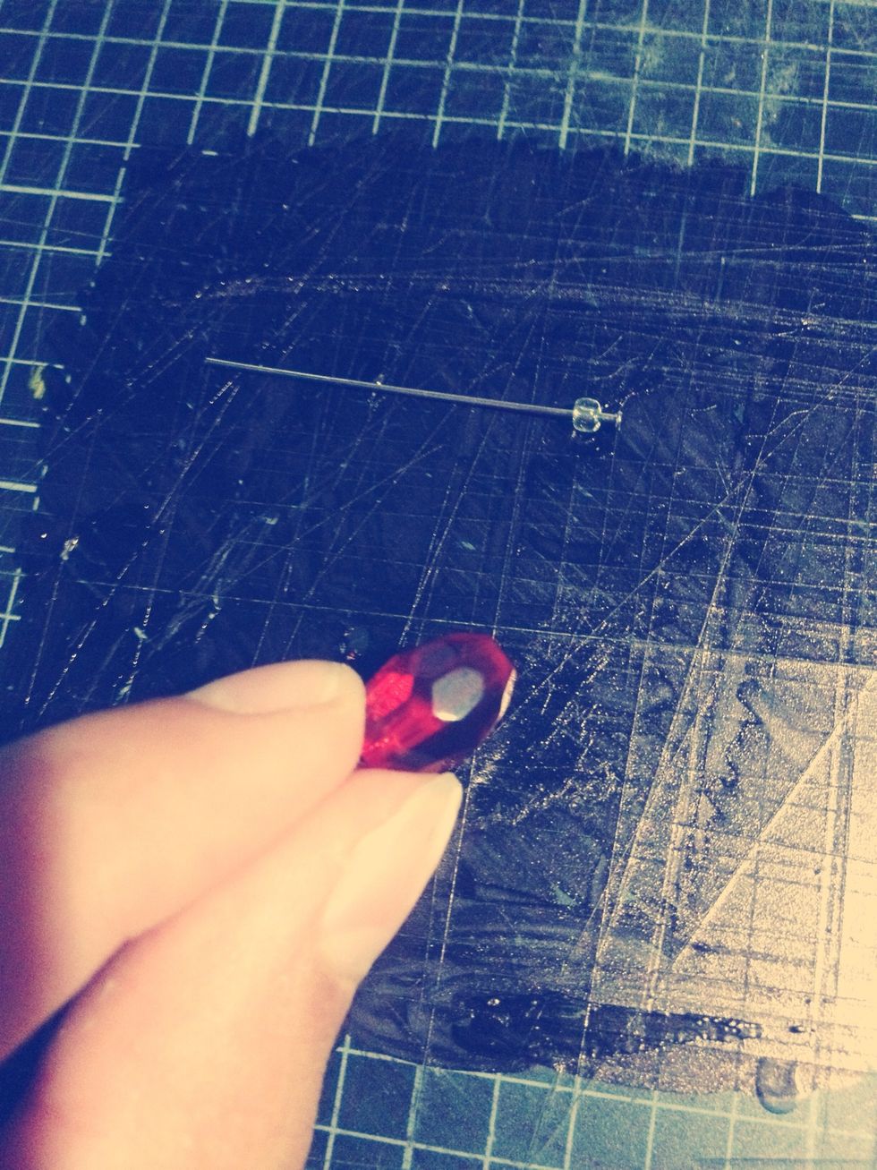 Take your large bead.