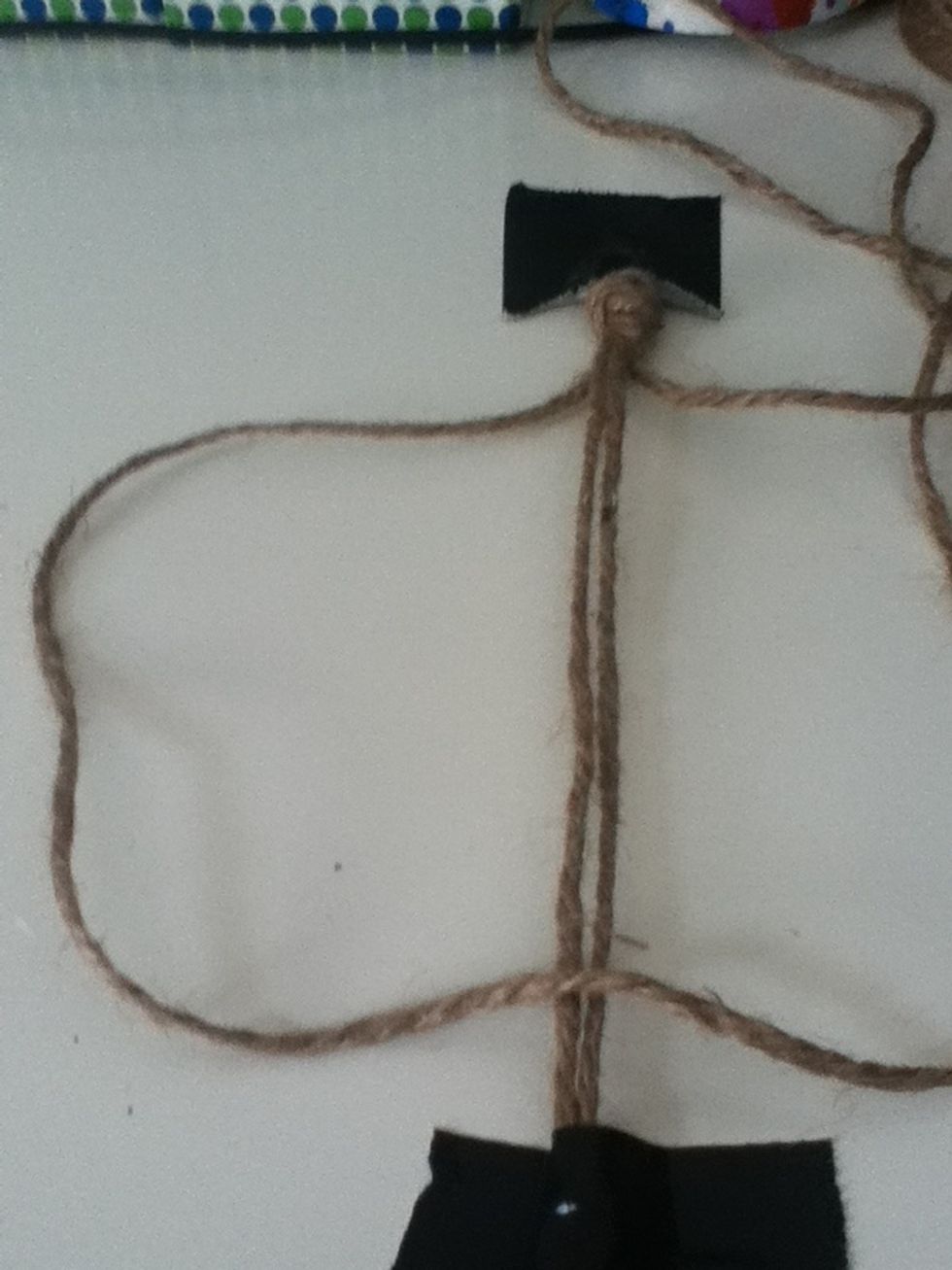 Take your left string and cross it over the middle two.