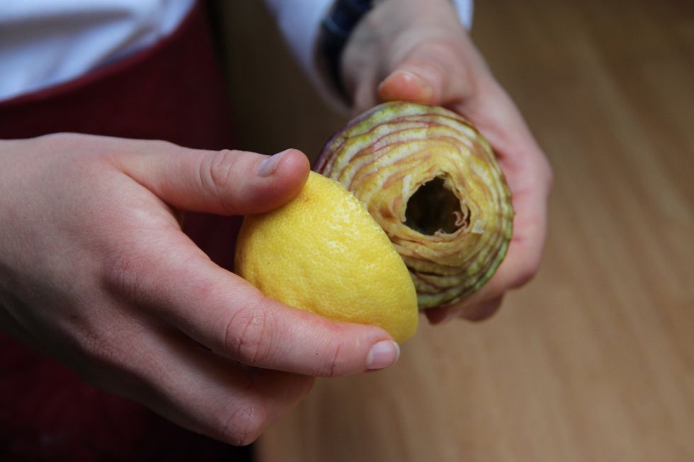 Take your lemon and pass it over the artichoke