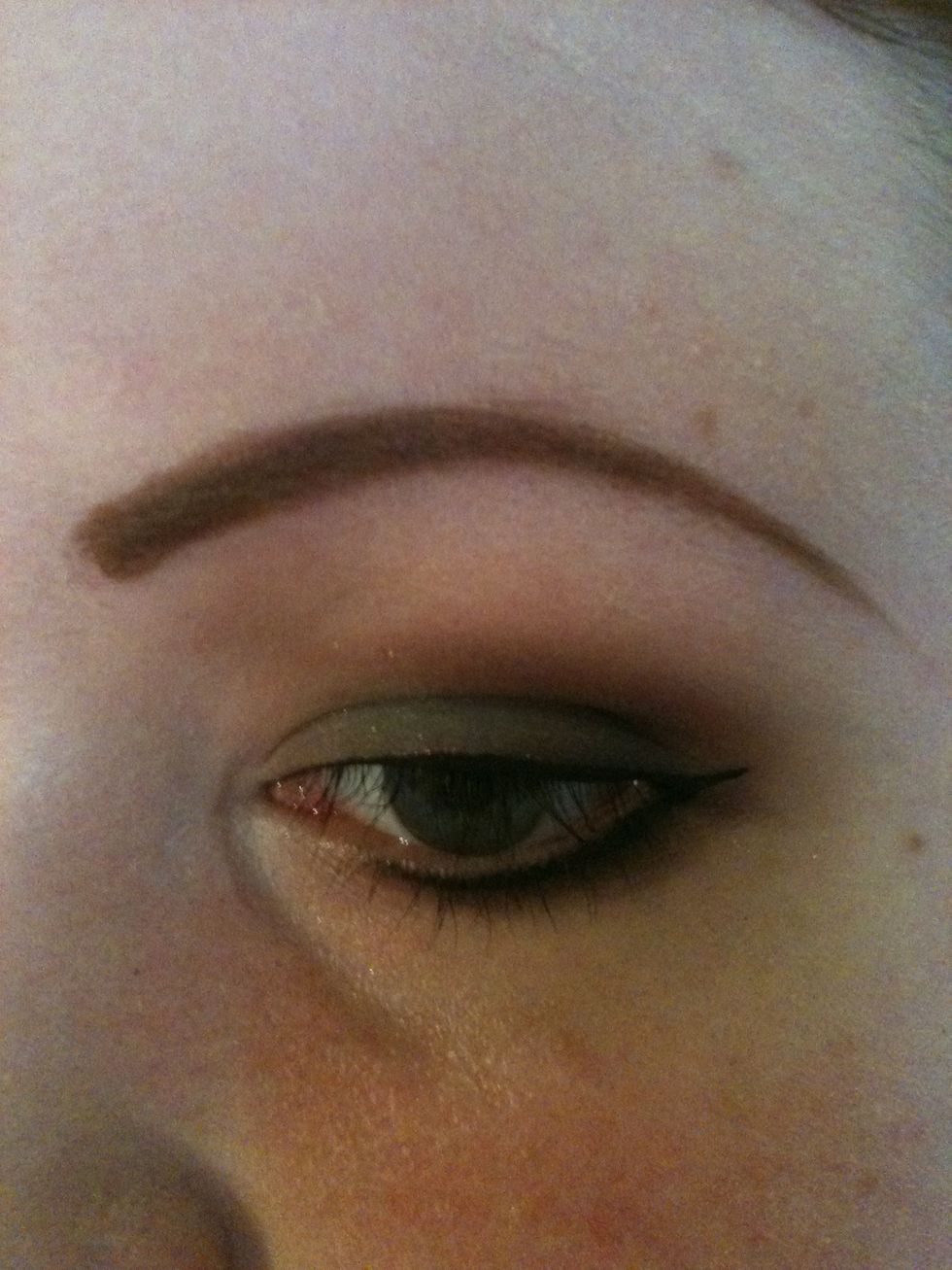 Take your liquid liner (if preferred) and line your top lid thinly. Add some to the lower lid for more definition.