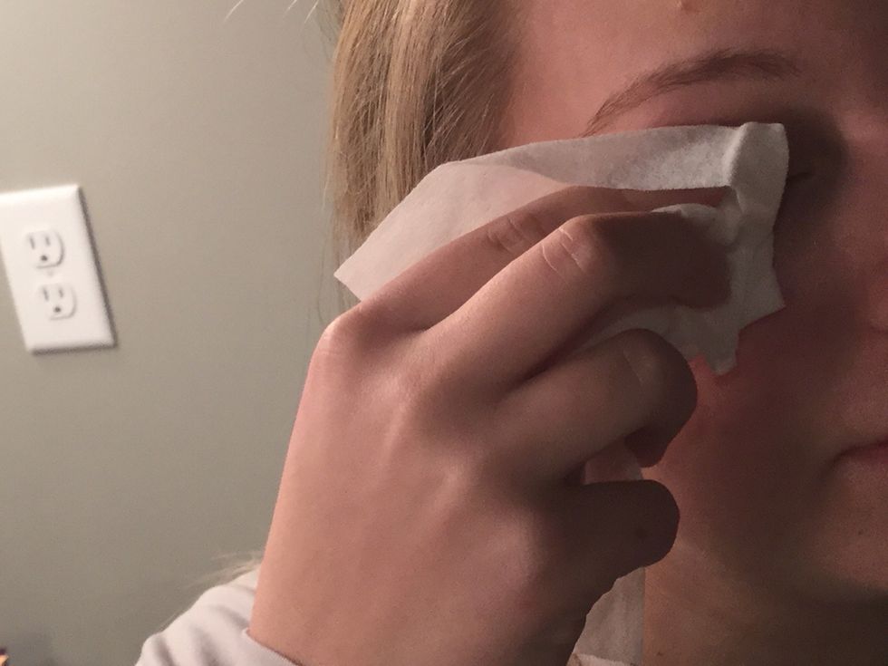Take your makeup wipe or cleansing towelette and wipe it all over your eye up to your eyebrow.
