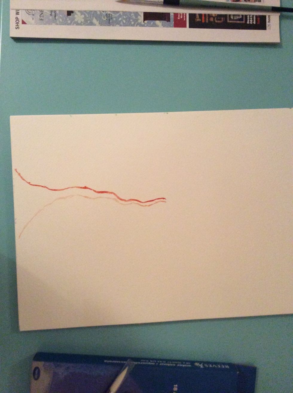 Take your paint brush and dip it into the burnt sienna and draw a line until you get half way up your page, your line does not have to be straight, make it a bit bendy in the lines