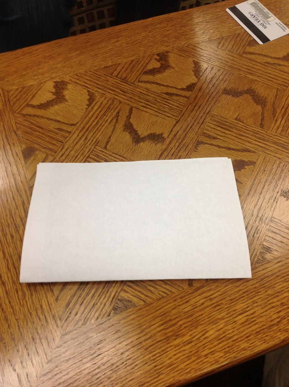 Take your paper and fold it in half.