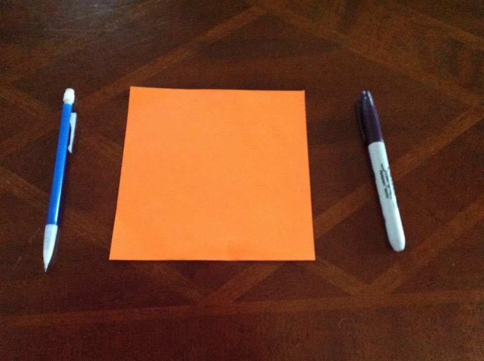 Take your paper, pencil, and pen/ marker to a flat surface to work on.