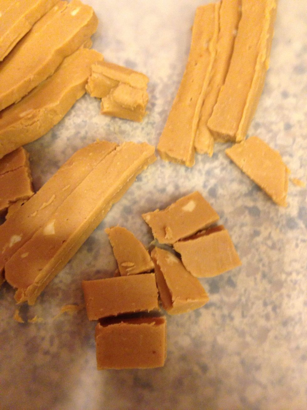 Take your peanut butter chunk out of the foil mold and cut into chunks.