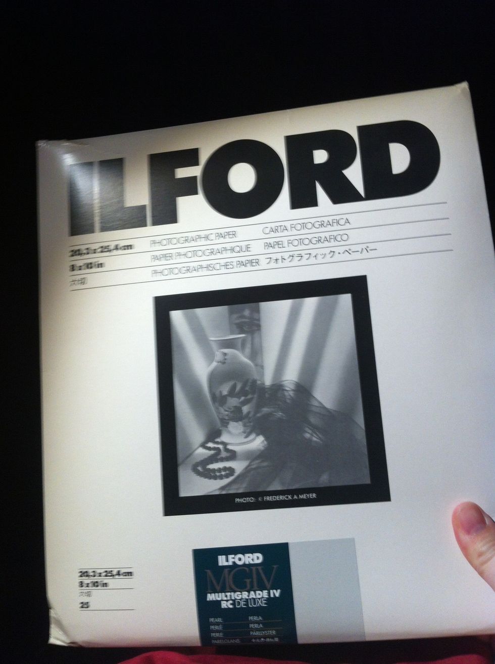 Take your photo paper, scissors, tape and can parts to a dark room.. Must be in the dark!! Cut your paper to approximate size and fit to the inside of the can. Tape it clear of the hole!!