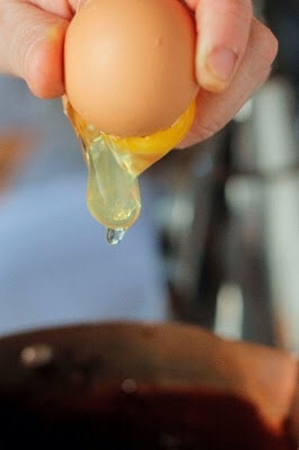 Take your pot or pan off the stove and whisk in the eggs, one at a time. Make sure each egg is well blended. The cake batter should be smooth and shiny.