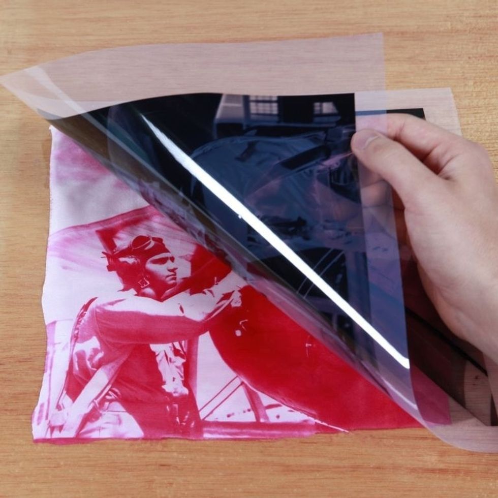 Take your print back indoors and remove the negative in subdued lighting.