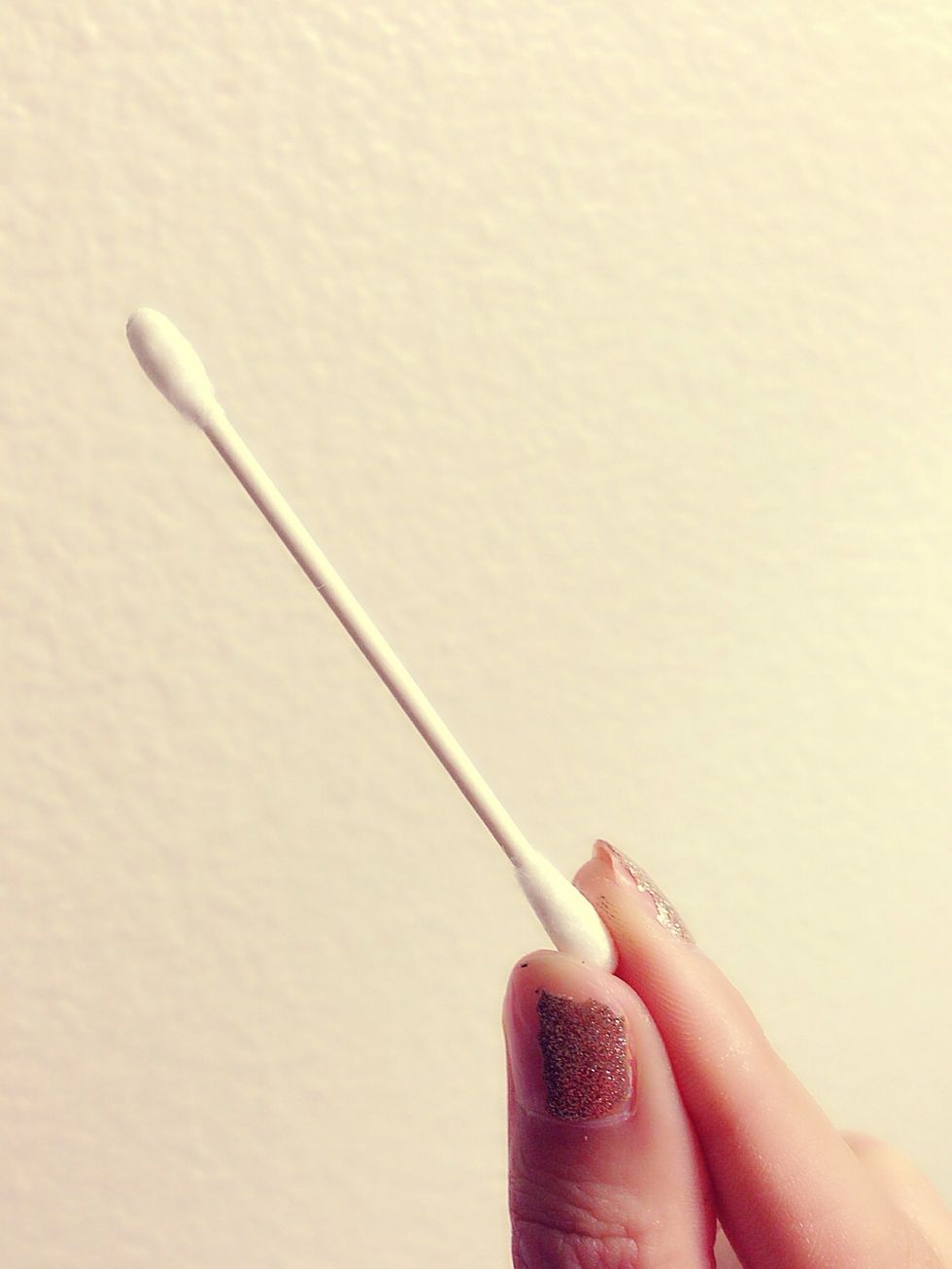 Take your q-tip in one hand