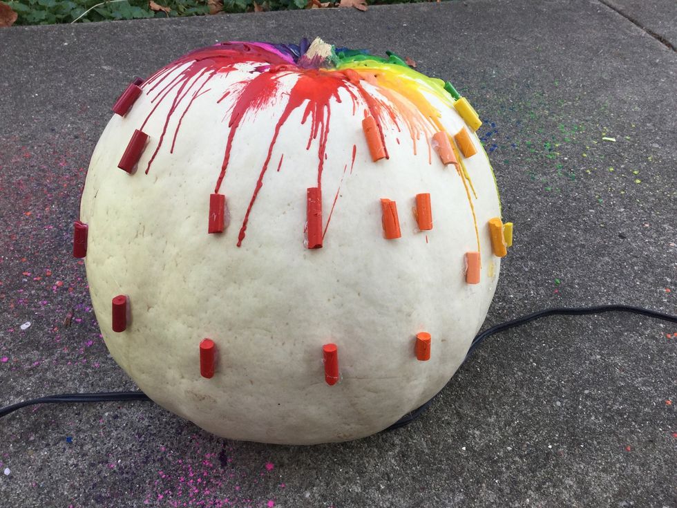 Take your remaining crayon halves and glue them in spots that have not been fully covered by the melted wax (you may not need this step). Repeat step 5 until you get your desired flow of colors.