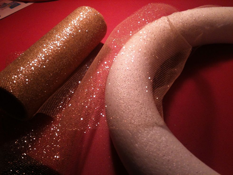 Take your "ribbon" and using your glue gun to hold it down, cover the ring.