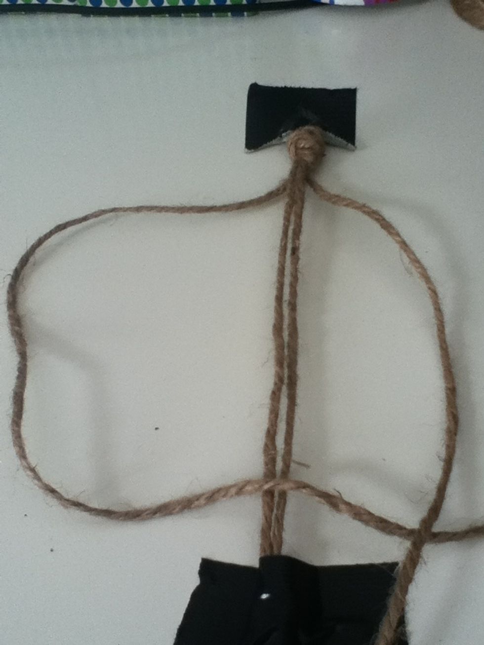 Take your right string and cross it over the left one.