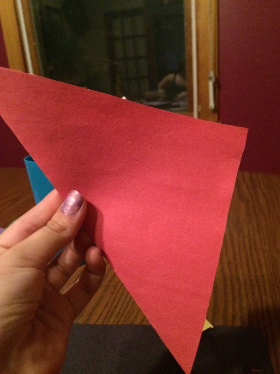 Take your scissors and snip the extra paper