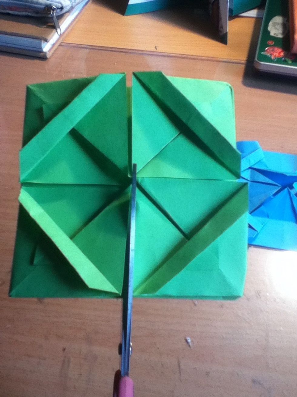 Take your scissors to the second one, cutting it into quarters