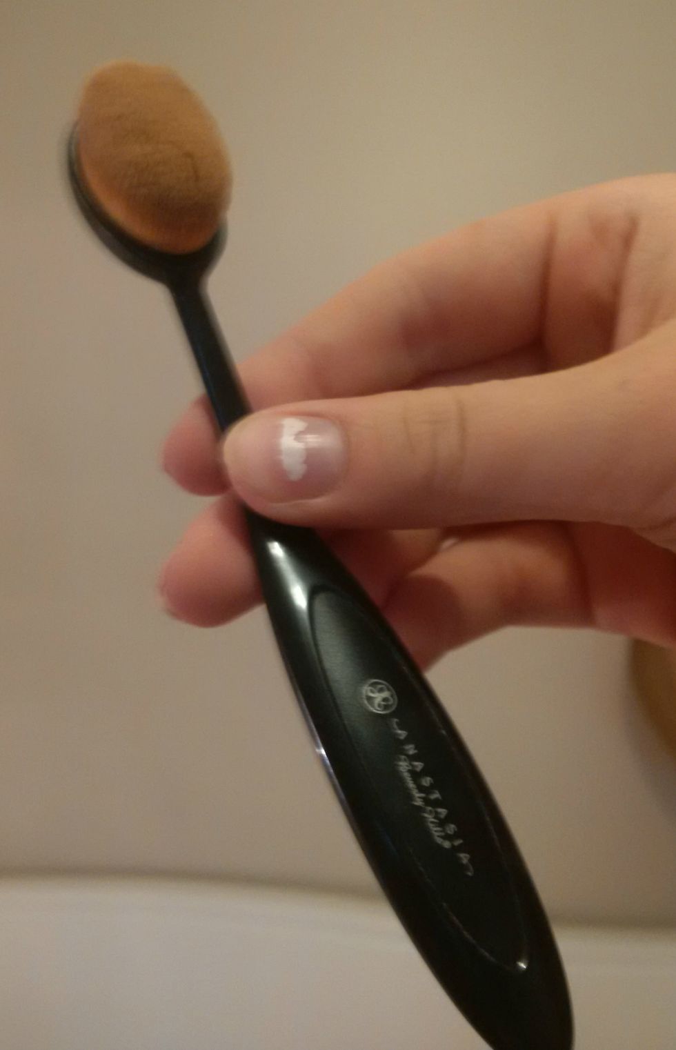 Take your small blending brush and blend the colours carefully together. I am using a small Anastasia Beverly Hills brush and its very good for getting into hard-to-reach places!