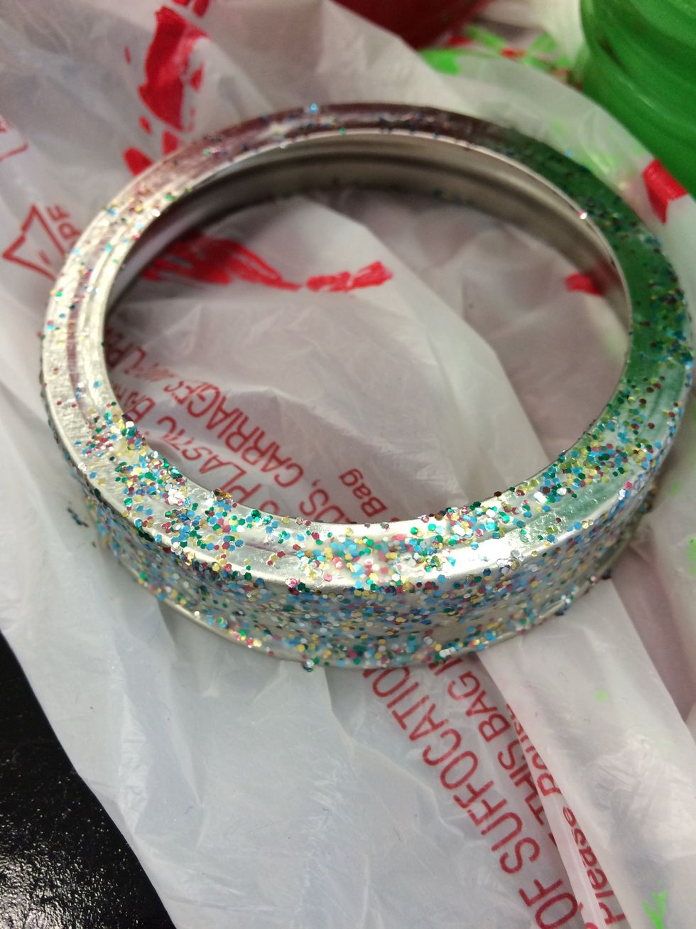 Take your sparkly paint and apply to the ring of the jars lid.