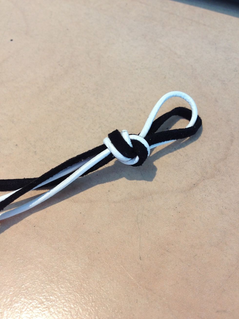 Take your thongs and make a knot.