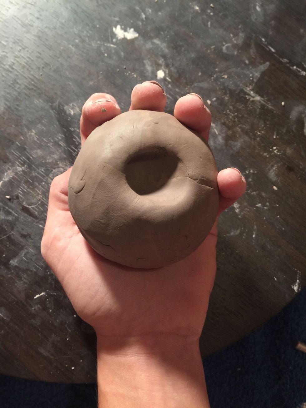 Take your thumb and poke a hole in the center