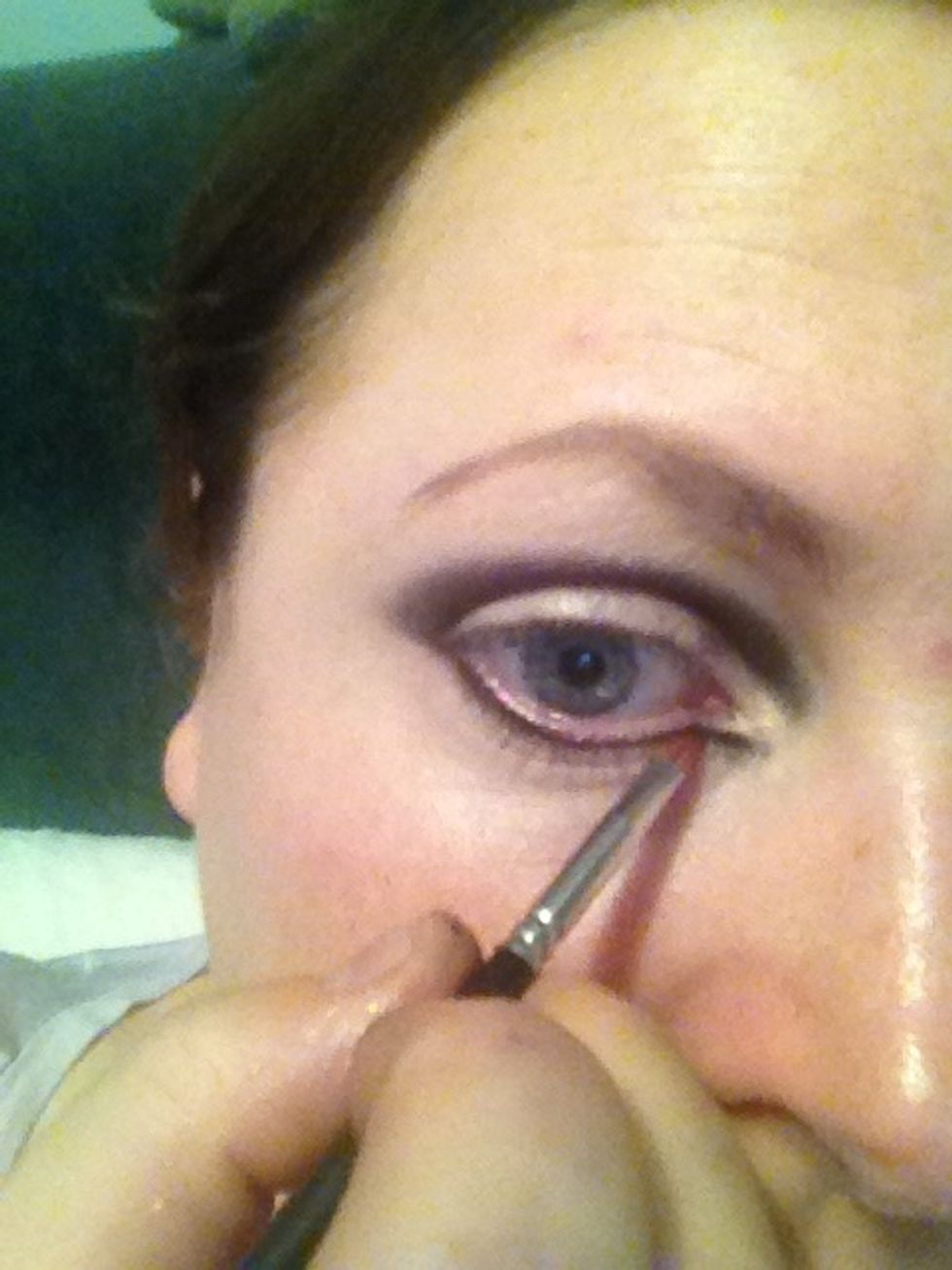 Taking a small liner brush I've took black shadow onto lash line and bringing into an angle at the tear duct