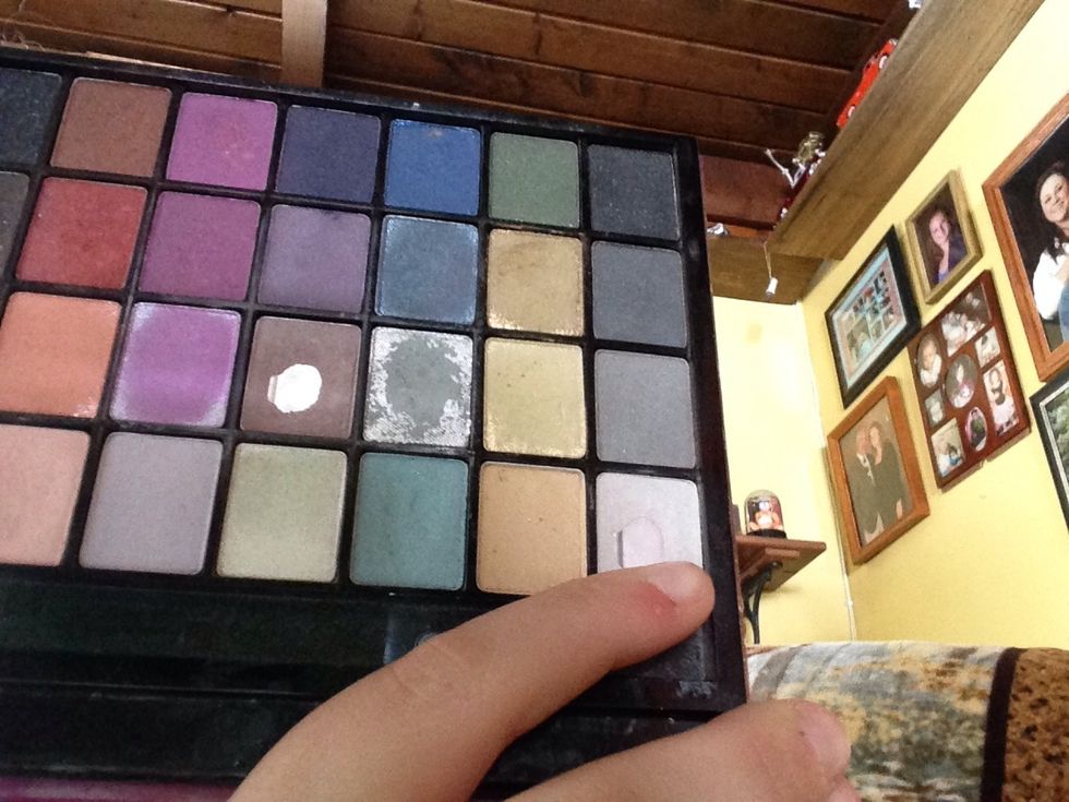 Taking a white color. I am going to put that on my inner coner and brow bone