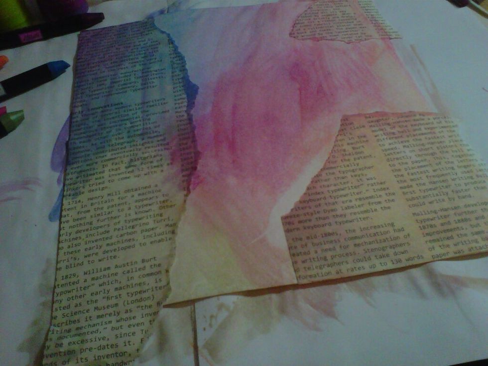 Taking book pages, tear and add to your page. Draw over with the water colour crayons then taking a paintbrush dip in water and go over the crayon to give water colour effect