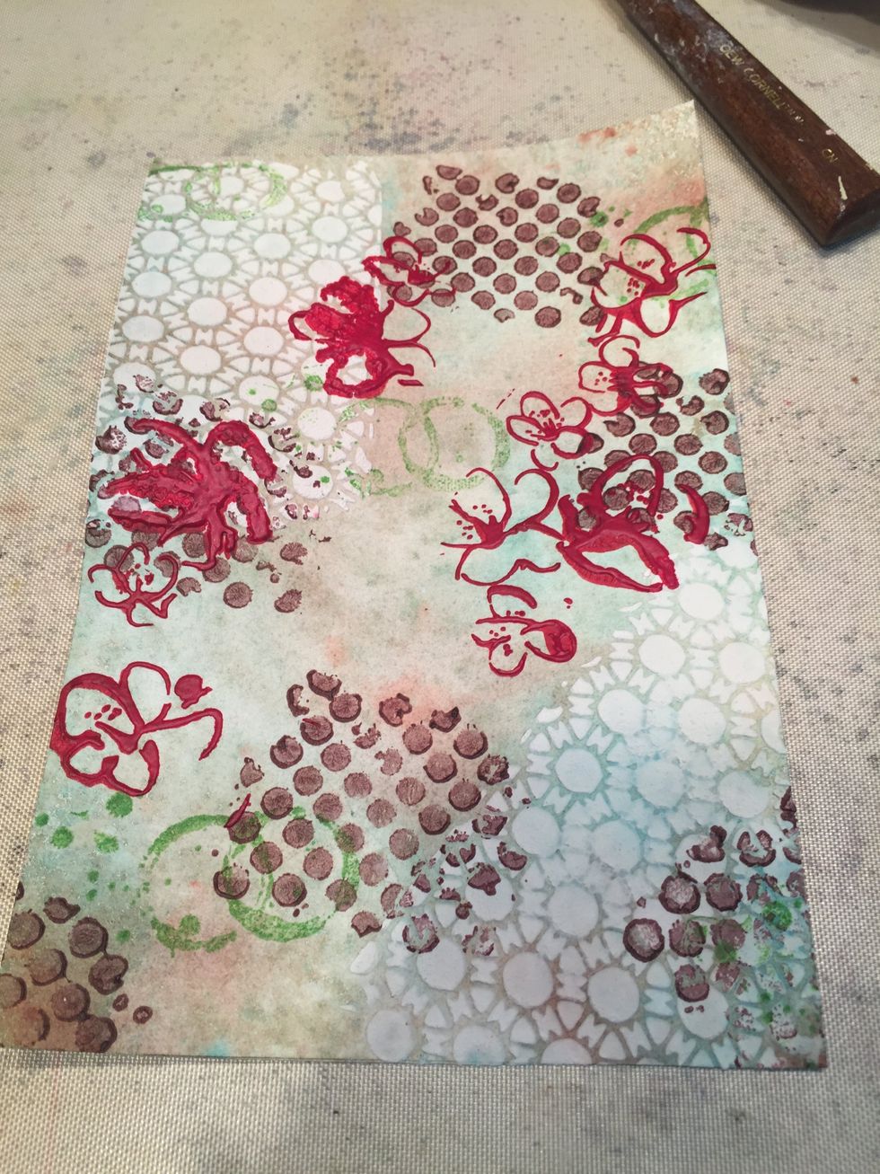 Taking the Blossom stencil, mask off the branches and stencil just the blossoms with Desire Velvet.