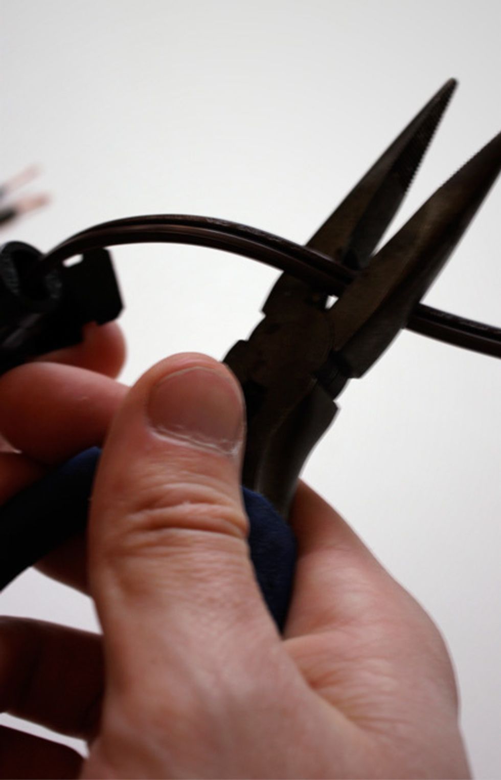 Taking the cord you purchased (or scavenged from an old appliance), use pliers to cut 12 inches from the plug leaving a blunt end. You now have a section of cord with an outlet plug on one end.