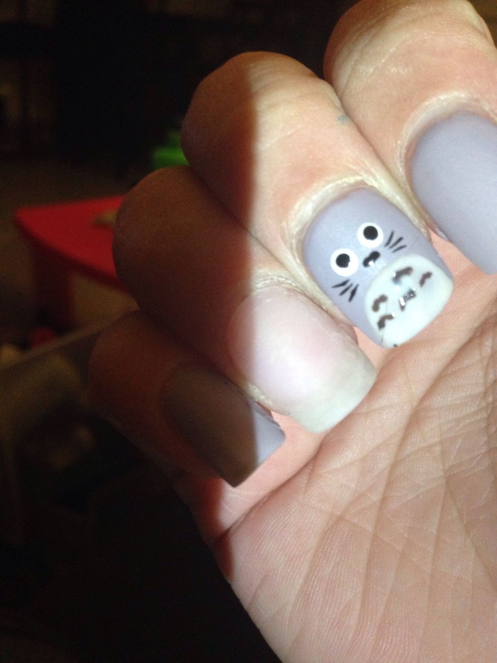 Taking the same small paintbrush add upside down V's on the belly