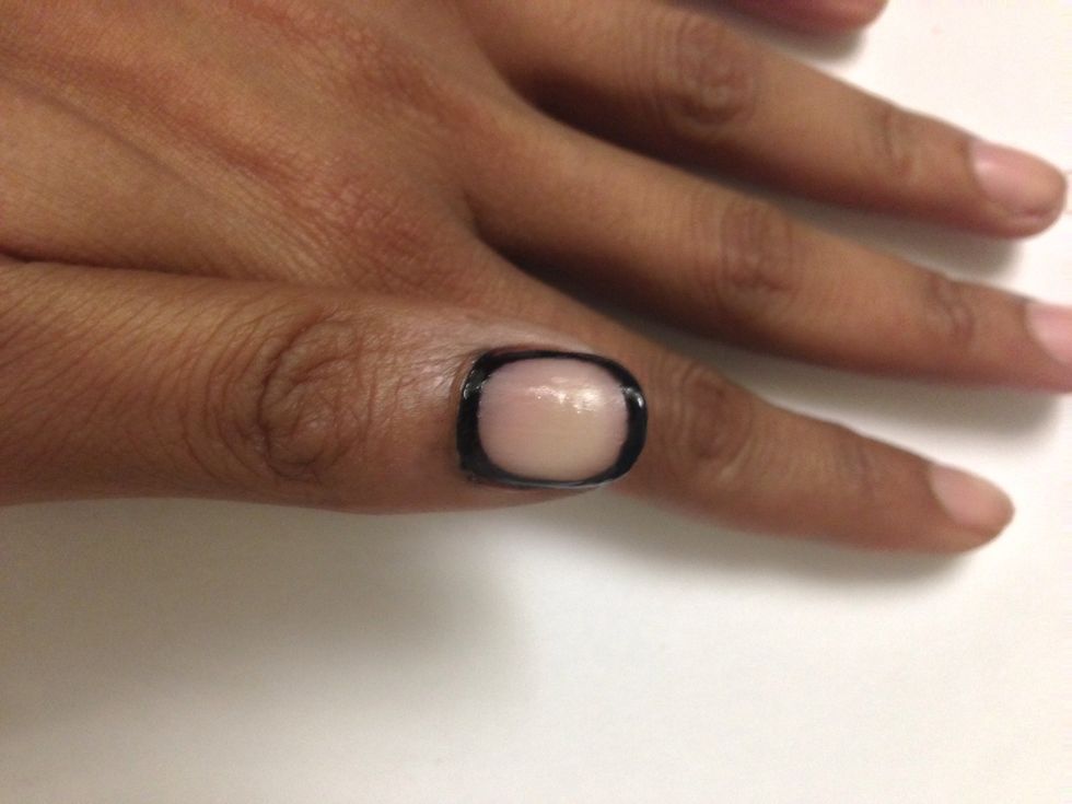 Taking your black nail art polish draw a line around your nail like so. I am using Kiss Brush On Nail Art Paint in Black.