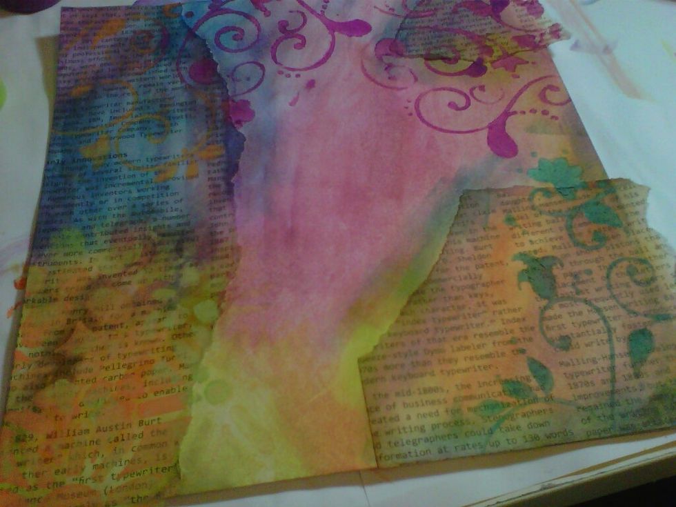 Taking your masks (I've used flowery swirls), dab your chosen acrylic paints through using a baby wipe