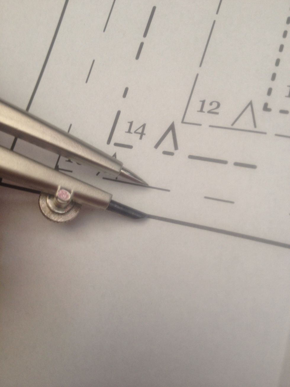 Taking your measurements into account, use the compass as a guide to follow along the pattern