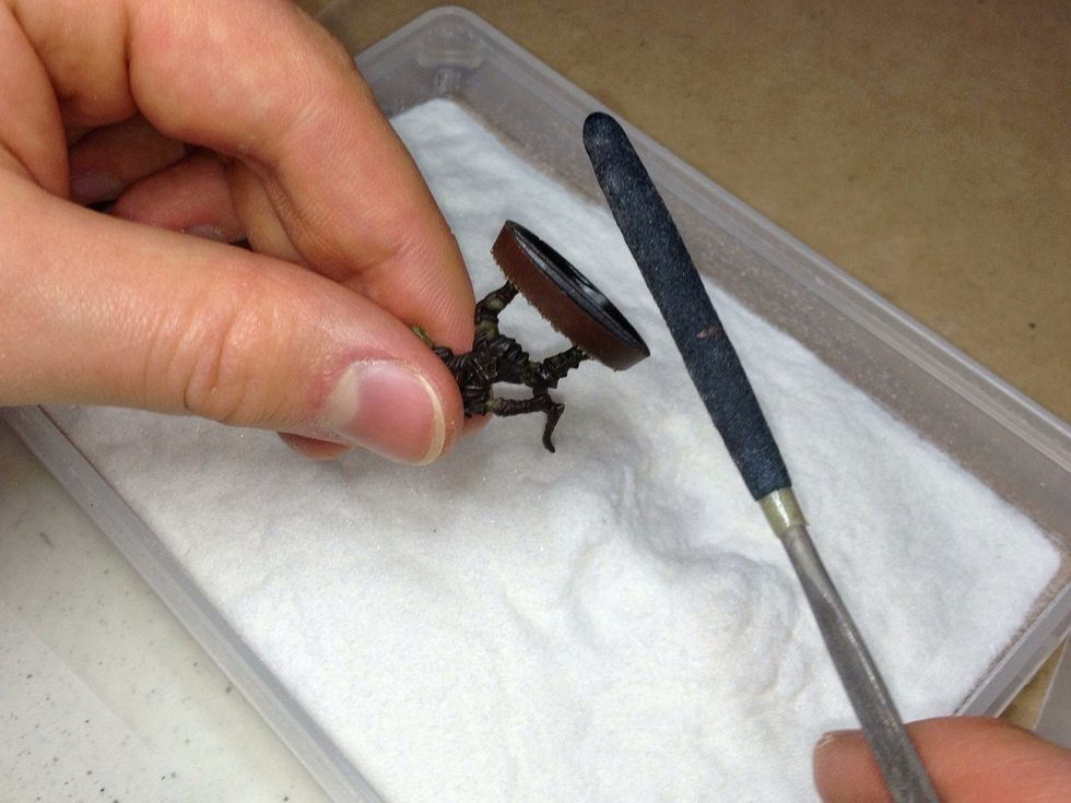 Tap off any excess flock back into the box.